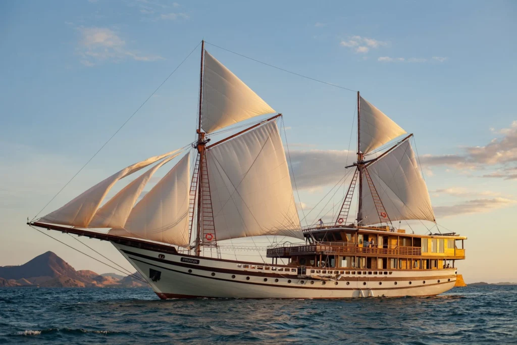 Sailing yacht in the ocean when sunset